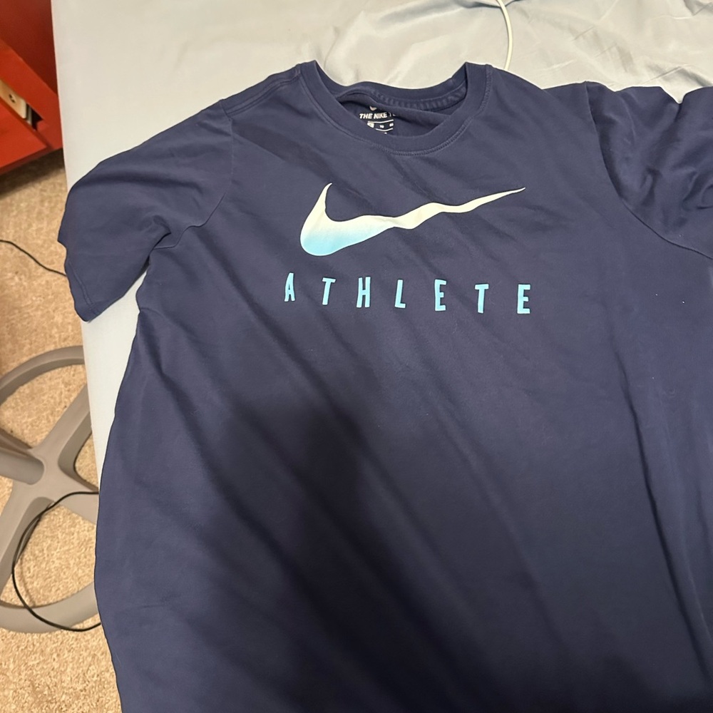 nike athlete shirt. kids XL/ adult small. in perfect condition